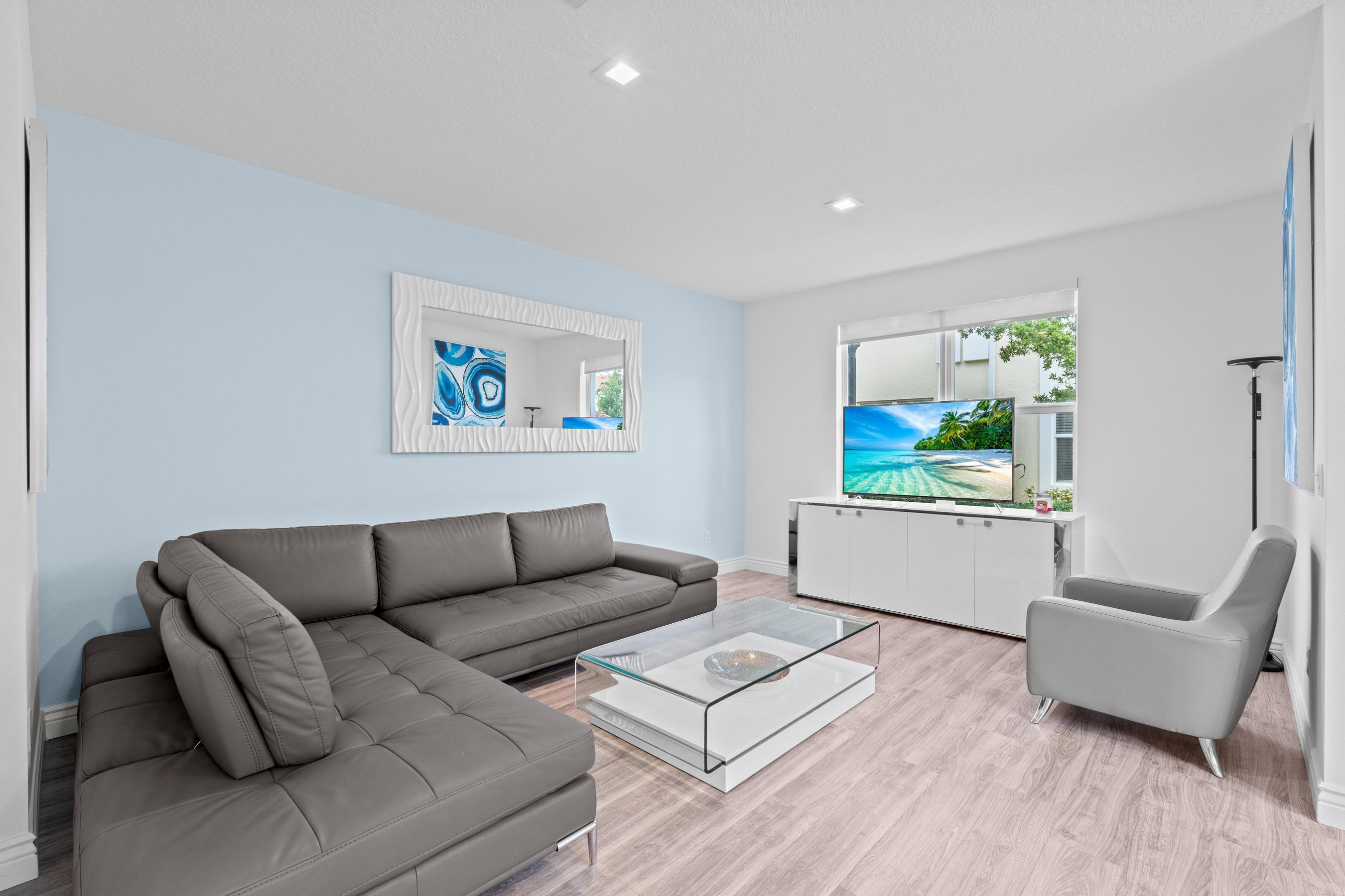 5010 Northwest 16th Way Boca Raton, FL 33431 - Photo 4 of 42 a living room with furniture and a wooden floor