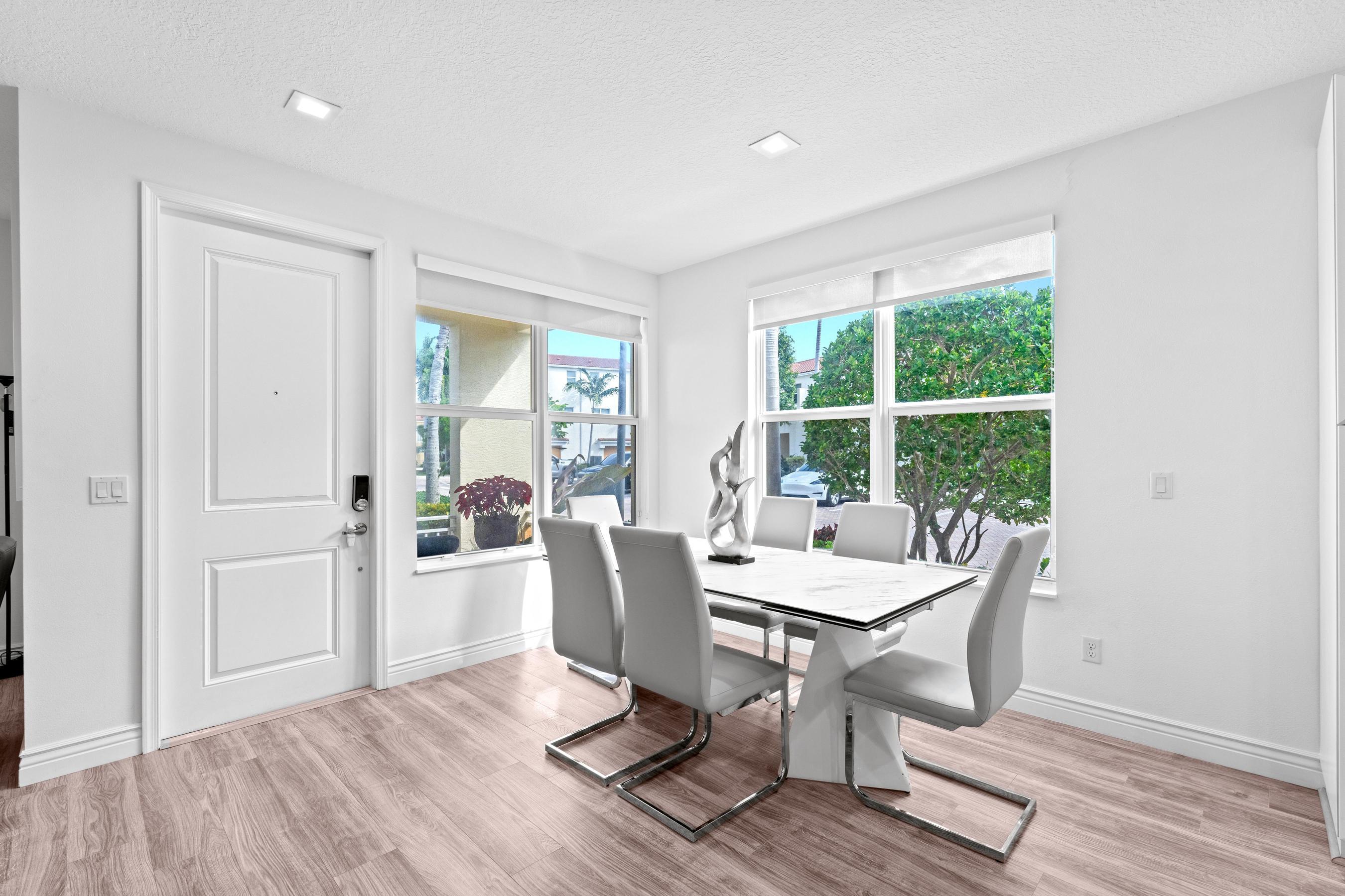 5010 Northwest 16th Way Boca Raton, FL 33431 - Photo 5 of 42 a dining room with furniture window wooden floor