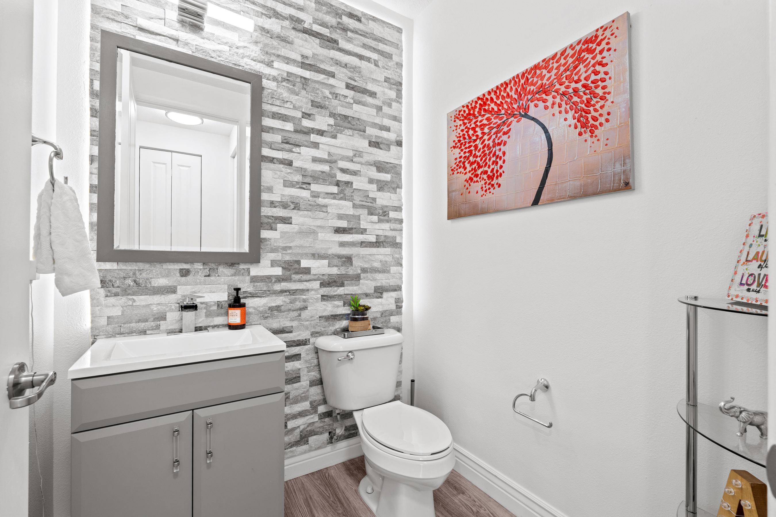 5010 Northwest 16th Way Boca Raton, FL 33431 - Photo 10 of 42 a bathroom with a sink and mirror with toilet
