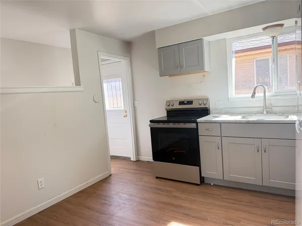a kitchen with a stove and a sink