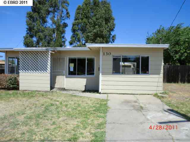 130 Peninsula Road Bay Point, CA 94565 - Photo 1 of 1 a house with trees in the background