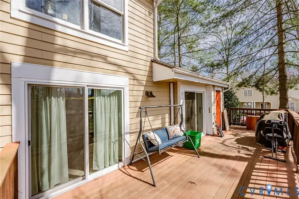 a view of a house with backyard and porch