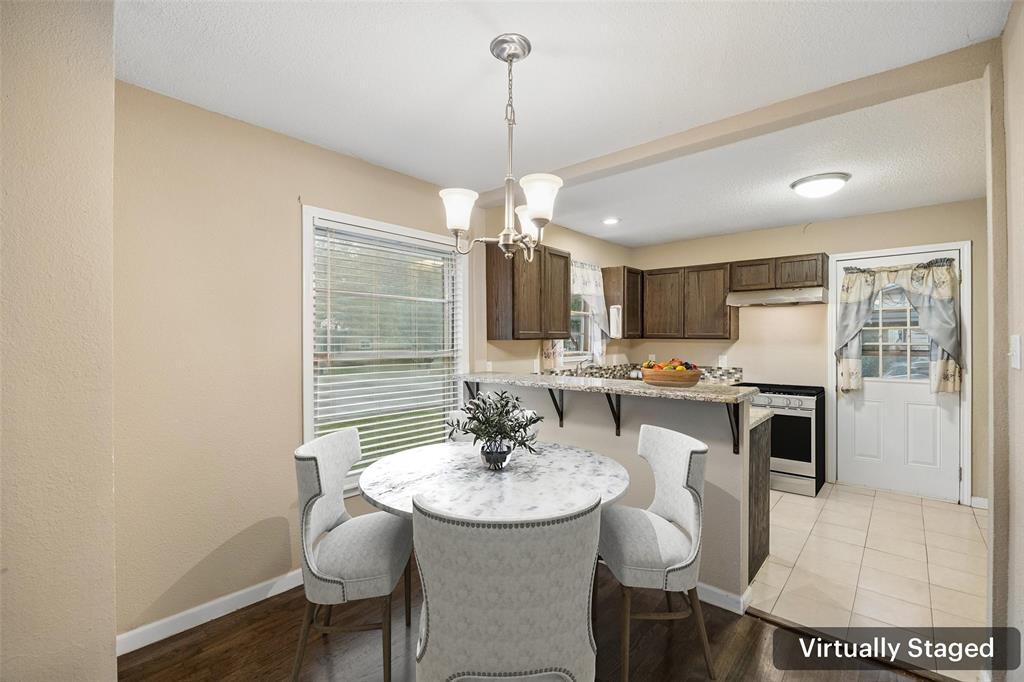 117 Moon Street Cleburne, TX 76033 - Photo 8 of 28 a kitchen with a table and chairs in it