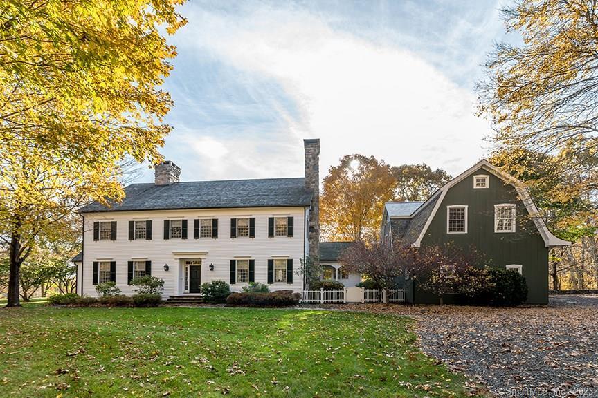 15 Farm Road Roxbury, CT 06783 - Photo 1 of 1 a view of a white building among the yard and large trees