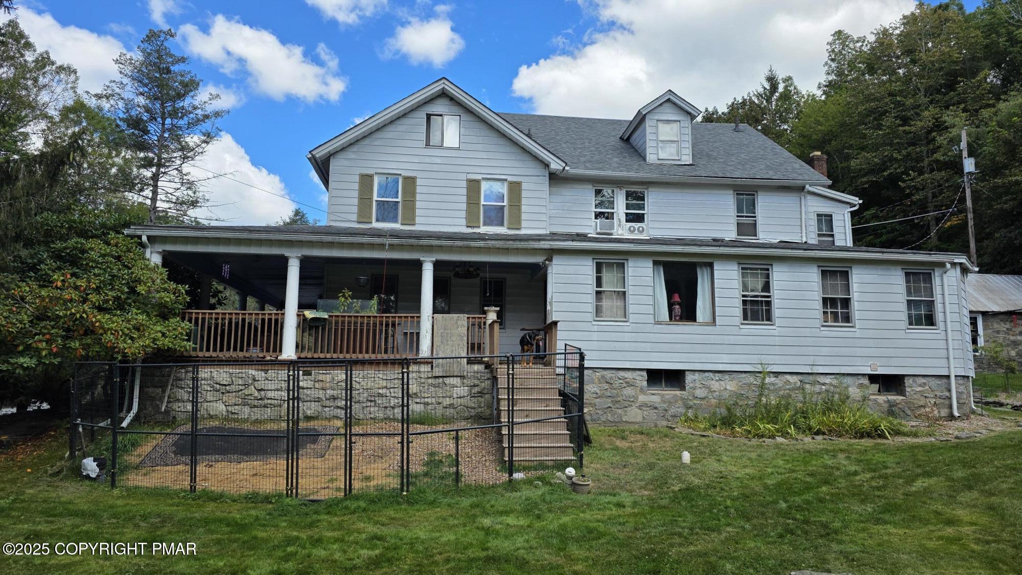 394 Highway 447 Newfoundland, PA 18445 - Photo 1 of 50 a front view of a house with a yard