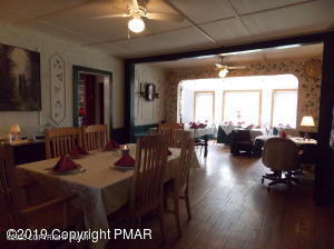 394 Highway 447 Newfoundland, PA 18445 - Photo 19 of 50 a view of a dining room with furniture window and wooden floor