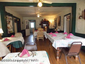 394 Highway 447 Newfoundland, PA 18445 - Photo 20 of 50 a living room with furniture a couch and wooden floor