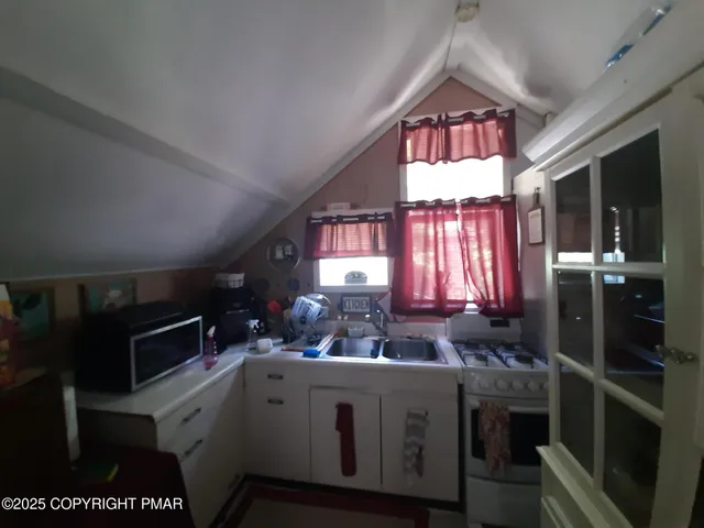 a bed room with a bed window and furniture