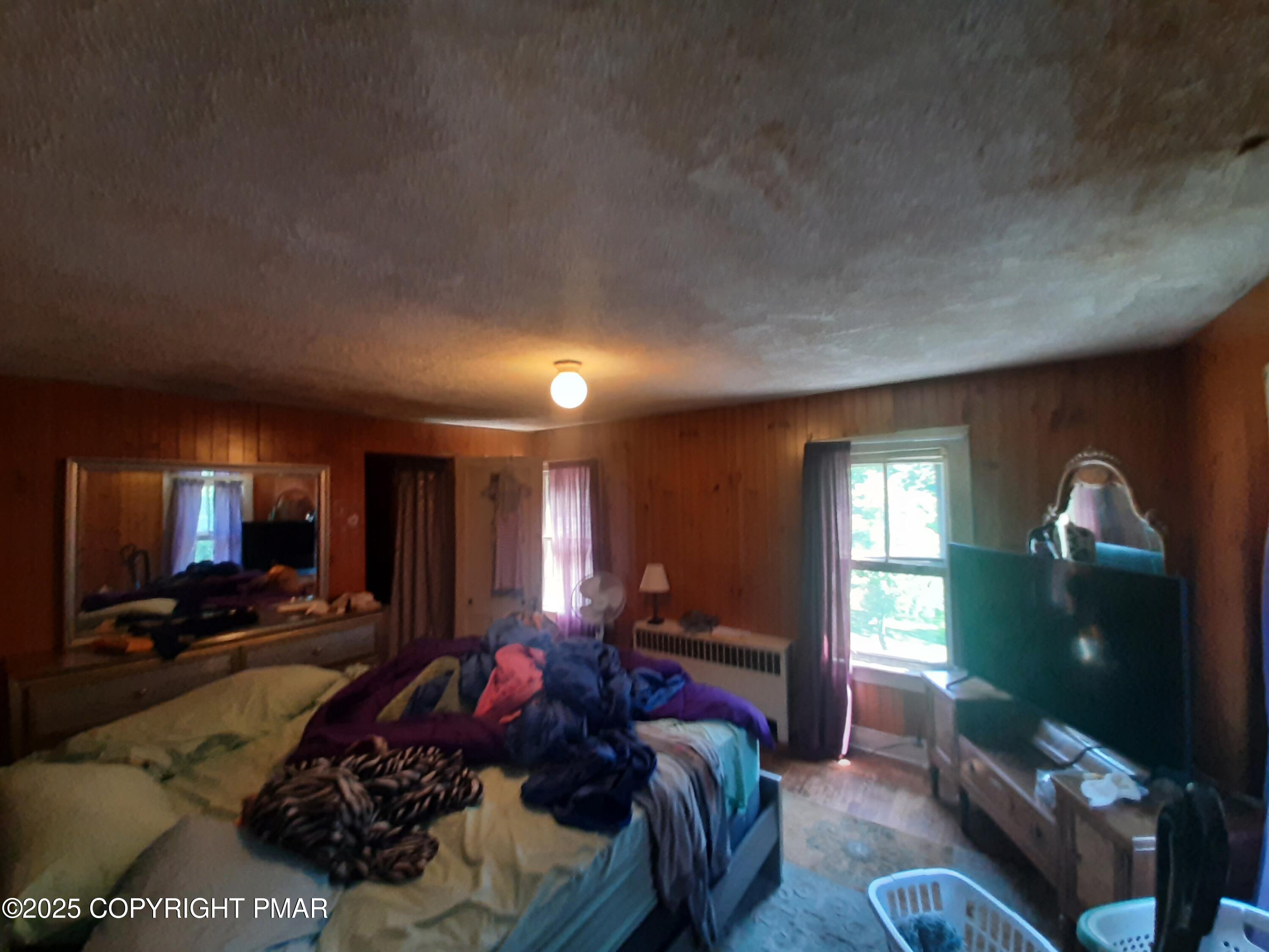 394 Highway 447 Newfoundland, PA 18445 - Photo 24 of 50 a bed room with a bed window and furniture