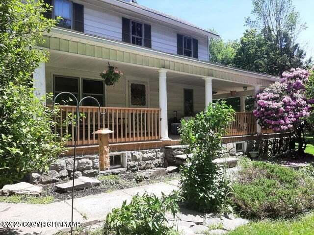 394 Highway 447 Newfoundland, PA 18445 - Photo 28 of 50 a front view of house with yard