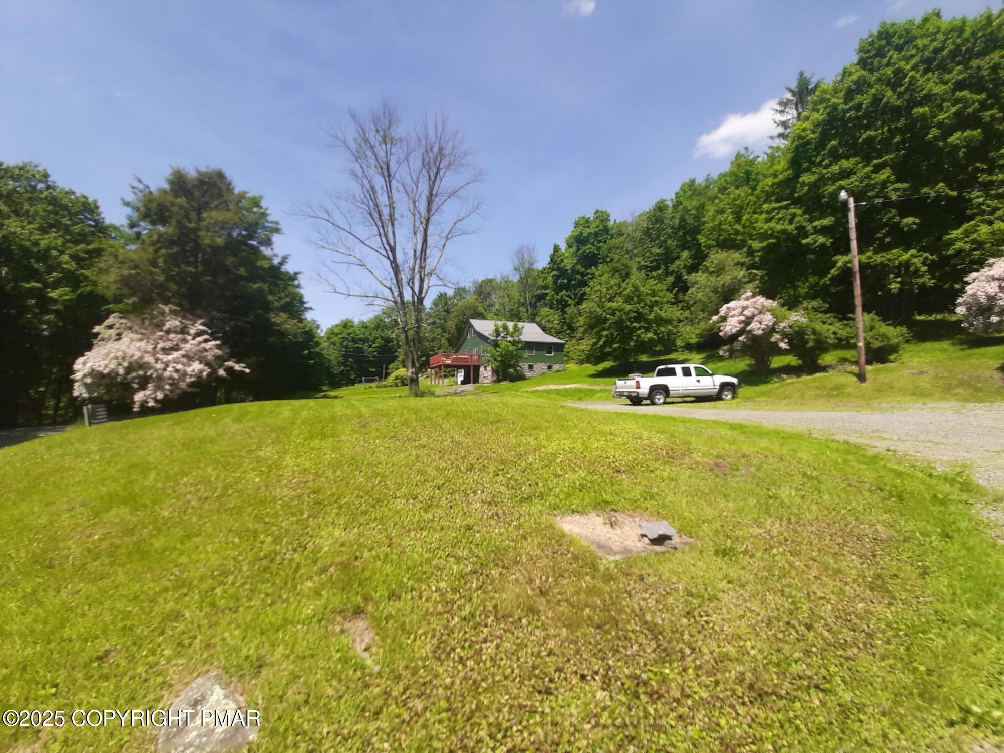 394 Highway 447 Newfoundland, PA 18445 - Photo 29 of 50 a view of a golf course with huge green field and trees