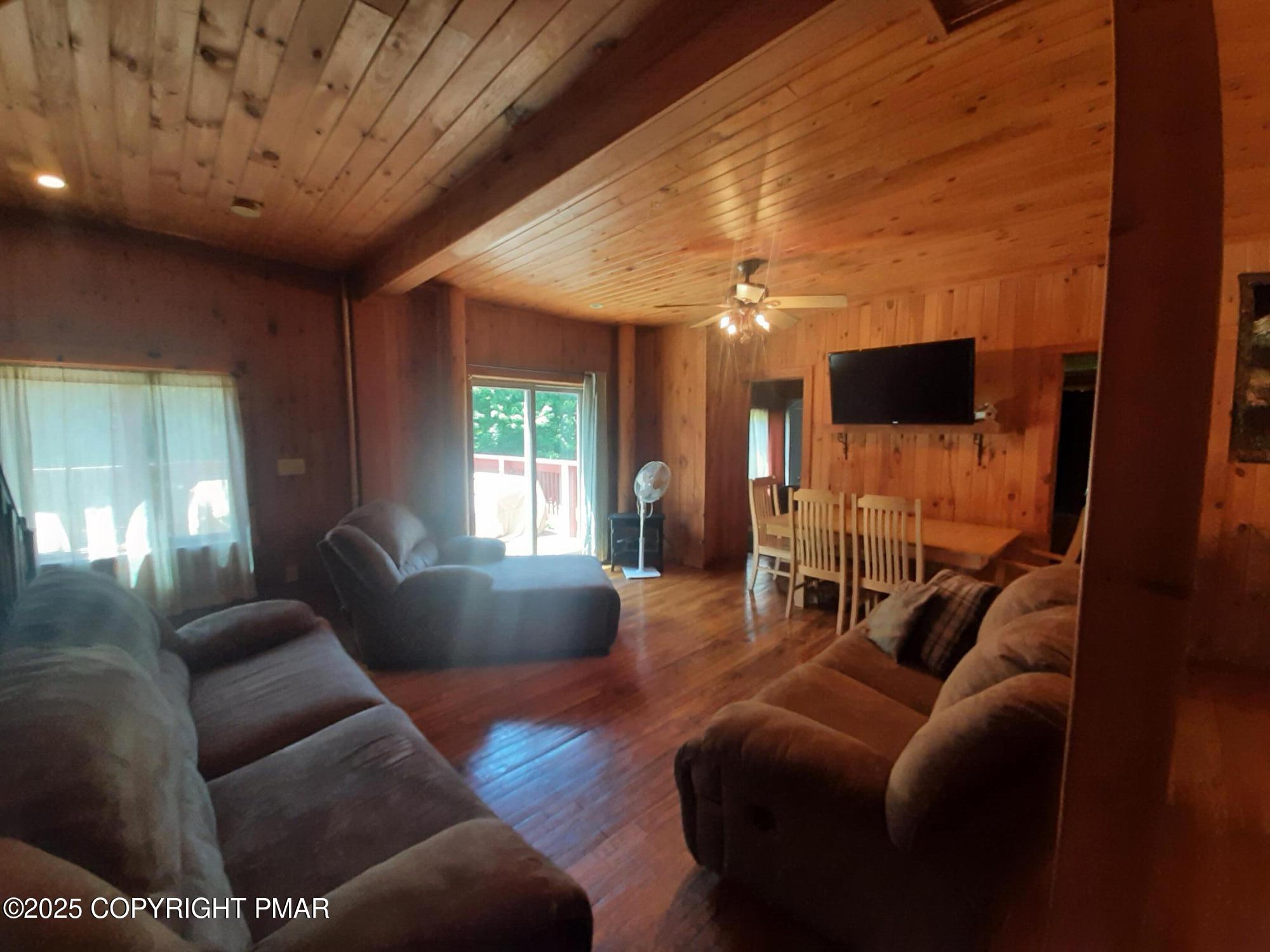 394 Highway 447 Newfoundland, PA 18445 - Photo 31 of 50 a living room with furniture and a flat screen tv