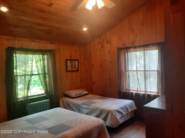 a view of a livingroom with furniture and a floor to ceiling window
