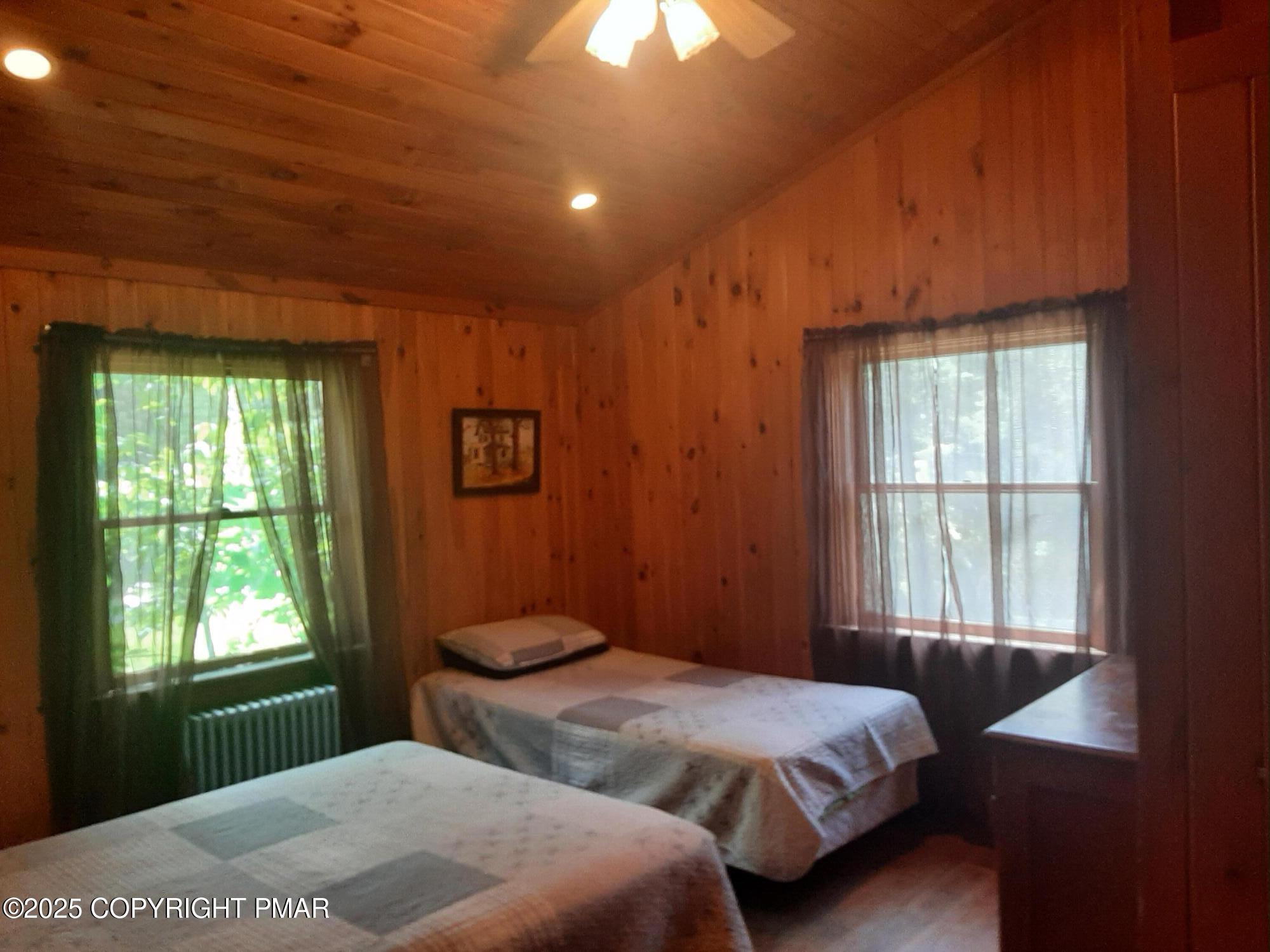 394 Highway 447 Newfoundland, PA 18445 - Photo 37 of 50 a bedroom with a bed and a window