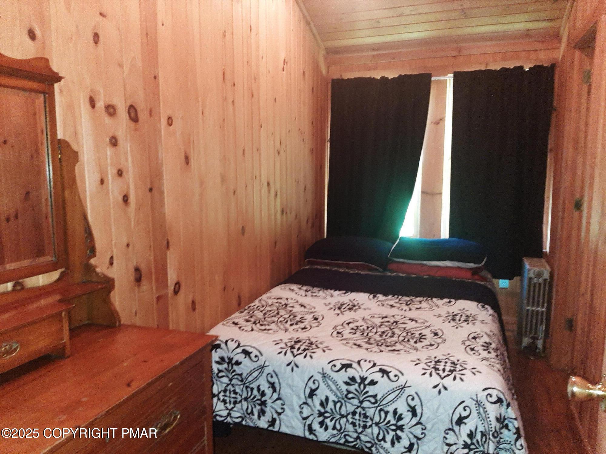 394 Highway 447 Newfoundland, PA 18445 - Photo 39 of 50 a bedroom with a bed and a window