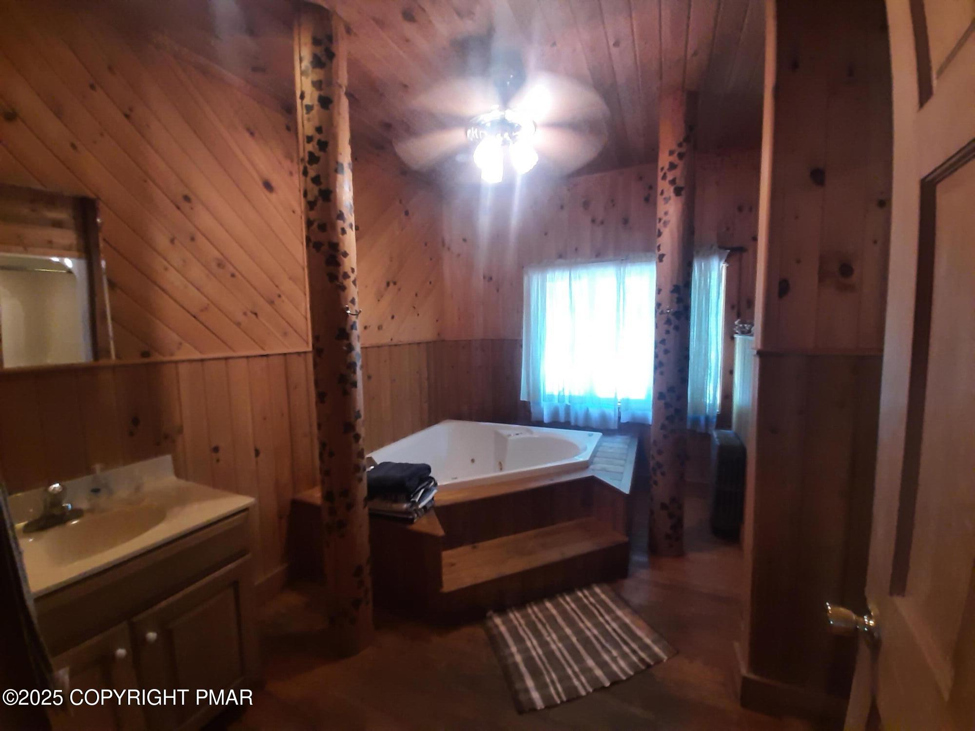 394 Highway 447 Newfoundland, PA 18445 - Photo 41 of 50 a bathroom with a sink and a mirror