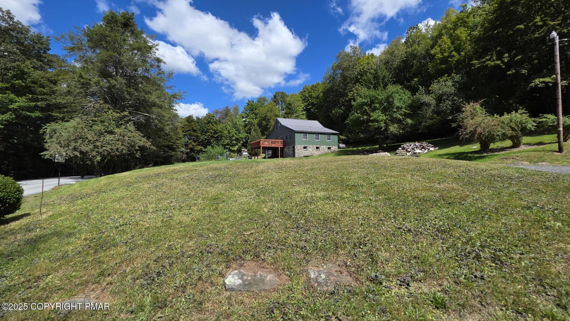 394 Highway 447 Newfoundland, PA 18445 - Photo 5 of 50 a yellow building in the middle of a field