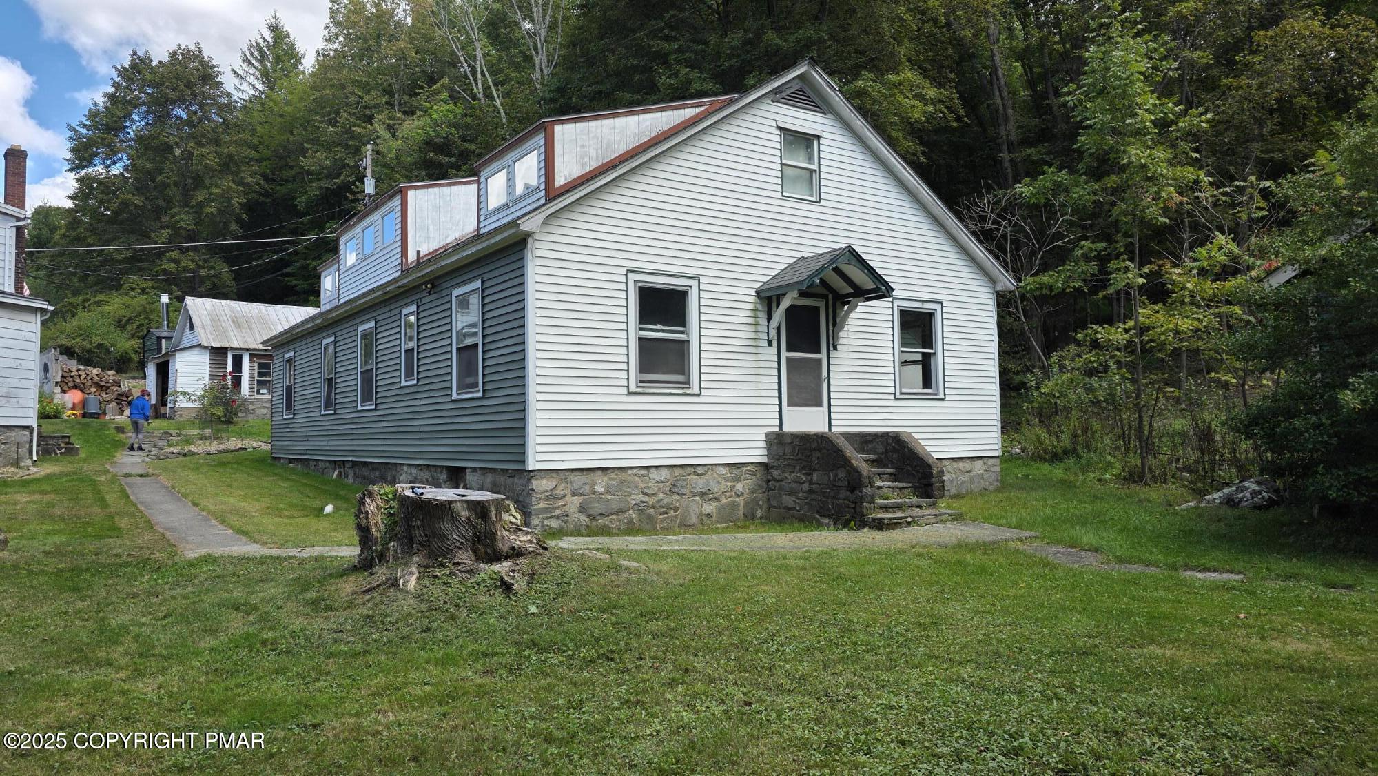 394 Highway 447 Newfoundland, PA 18445 - Photo 8 of 50 a view of a house with a yard