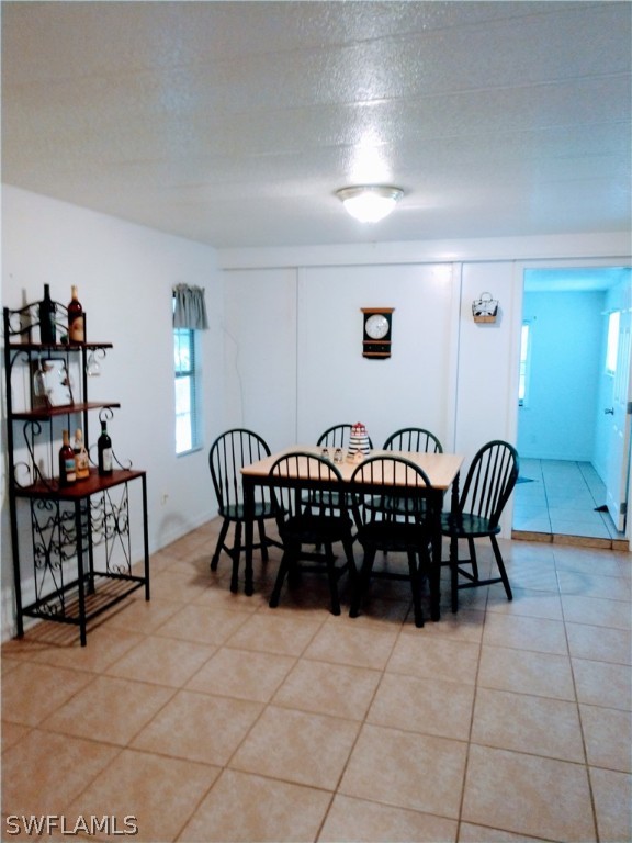 7351 Pinehurst Road Bokeelia, FL 33922 - Photo 13 of 31 a view of a dining room with furniture