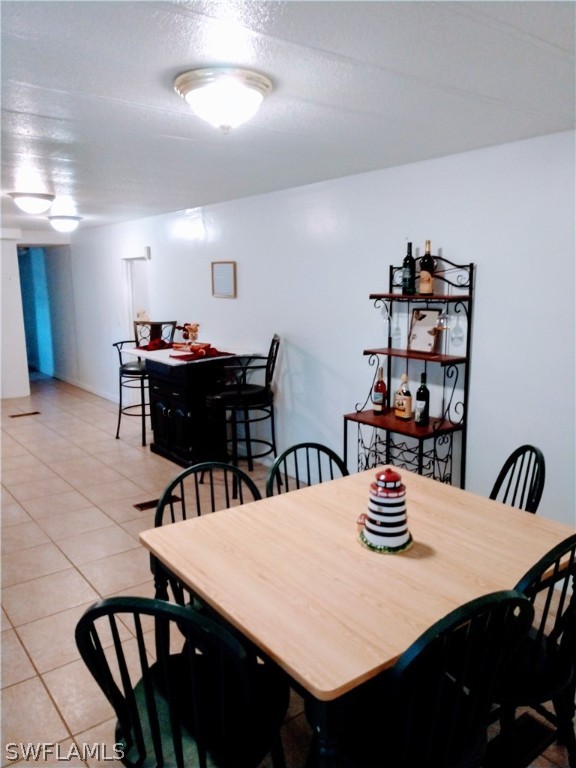 7351 Pinehurst Road Bokeelia, FL 33922 - Photo 15 of 31 a view of a dining room with furniture