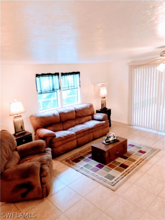 7351 Pinehurst Road Bokeelia, FL 33922 - Photo 17 of 31 a living room with furniture and a window