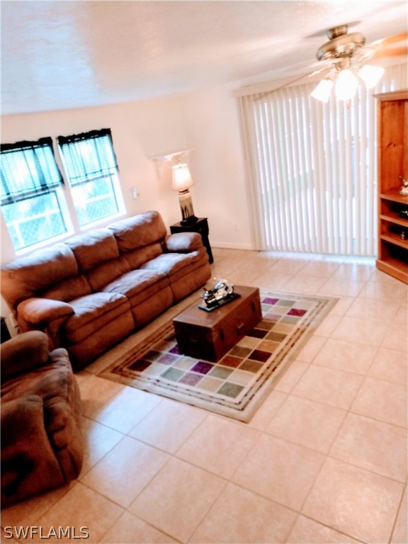 7351 Pinehurst Road Bokeelia, FL 33922 - Photo 18 of 31 a living room with furniture and a window