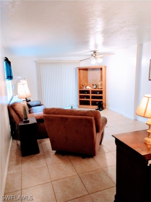 7351 Pinehurst Road Bokeelia, FL 33922 - Photo 19 of 31 a living room with furniture and a flat screen tv