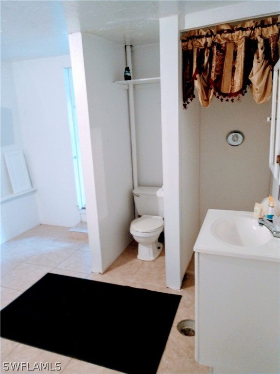 7351 Pinehurst Road Bokeelia, FL 33922 - Photo 28 of 31 a bathroom with a sink and a toilet