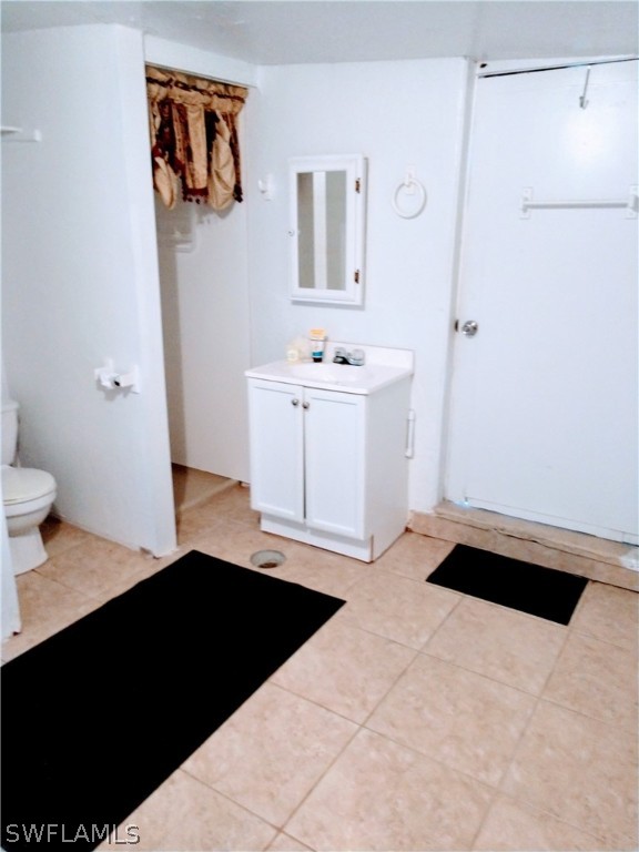 7351 Pinehurst Road Bokeelia, FL 33922 - Photo 29 of 31 a bathroom with a sink and a mirror