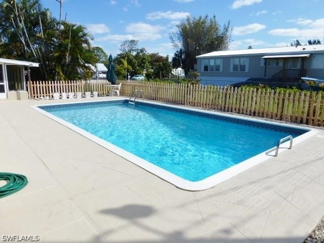 7351 Pinehurst Road Bokeelia, FL 33922 - Photo 6 of 31 a view of a swimming pool with a patio