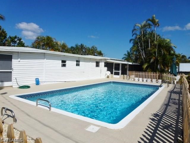 7351 Pinehurst Road Bokeelia, FL 33922 - Photo 7 of 31 a view of a house with backyard and trees