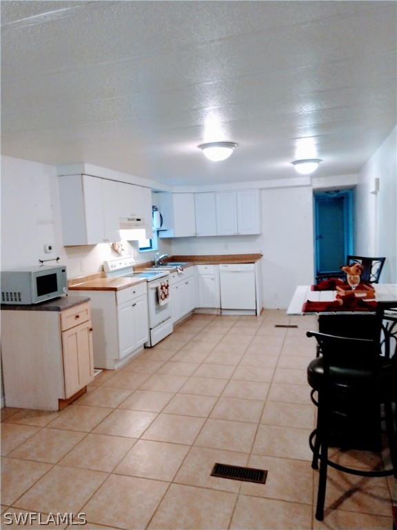 7351 Pinehurst Road Bokeelia, FL 33922 - Photo 10 of 31 a kitchen with a cabinets and appliances
