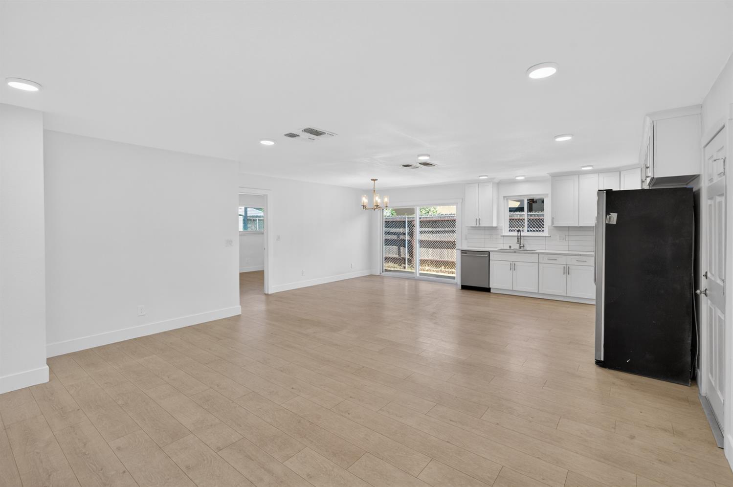 10457 Rockingham Drive Rancho Cordova, CA 95670 - Photo 12 of 49 a view of a kitchen with refrigerator and a stove
