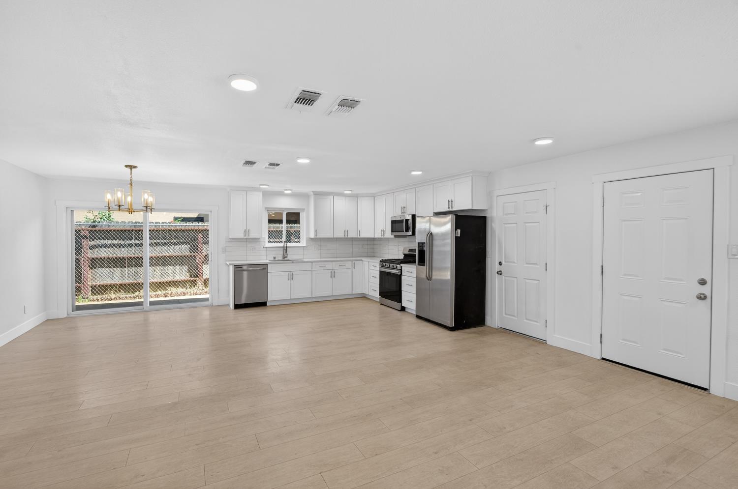 10457 Rockingham Drive Rancho Cordova, CA 95670 - Photo 13 of 49 a view of a kitchen with a stove cabinets and a kitchen