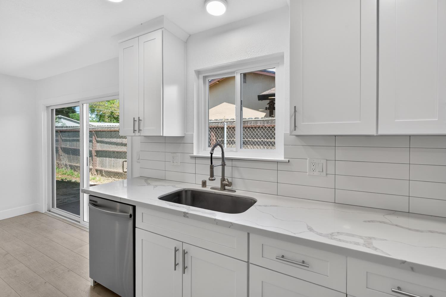 10457 Rockingham Drive Rancho Cordova, CA 95670 - Photo 15 of 49 a kitchen with a sink and cabinets
