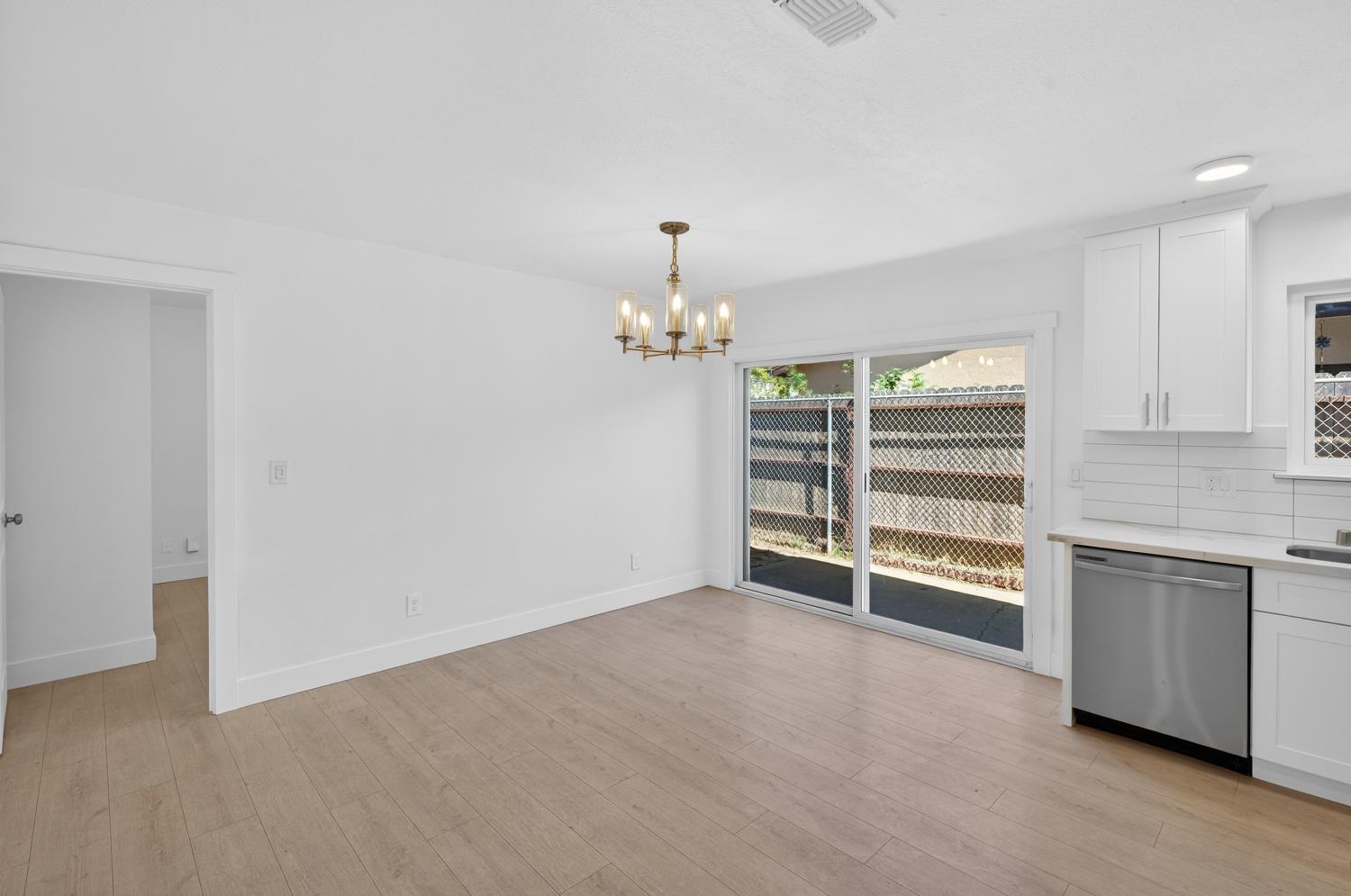 10457 Rockingham Drive Rancho Cordova, CA 95670 - Photo 19 of 49 wooden floor in an empty room with a window