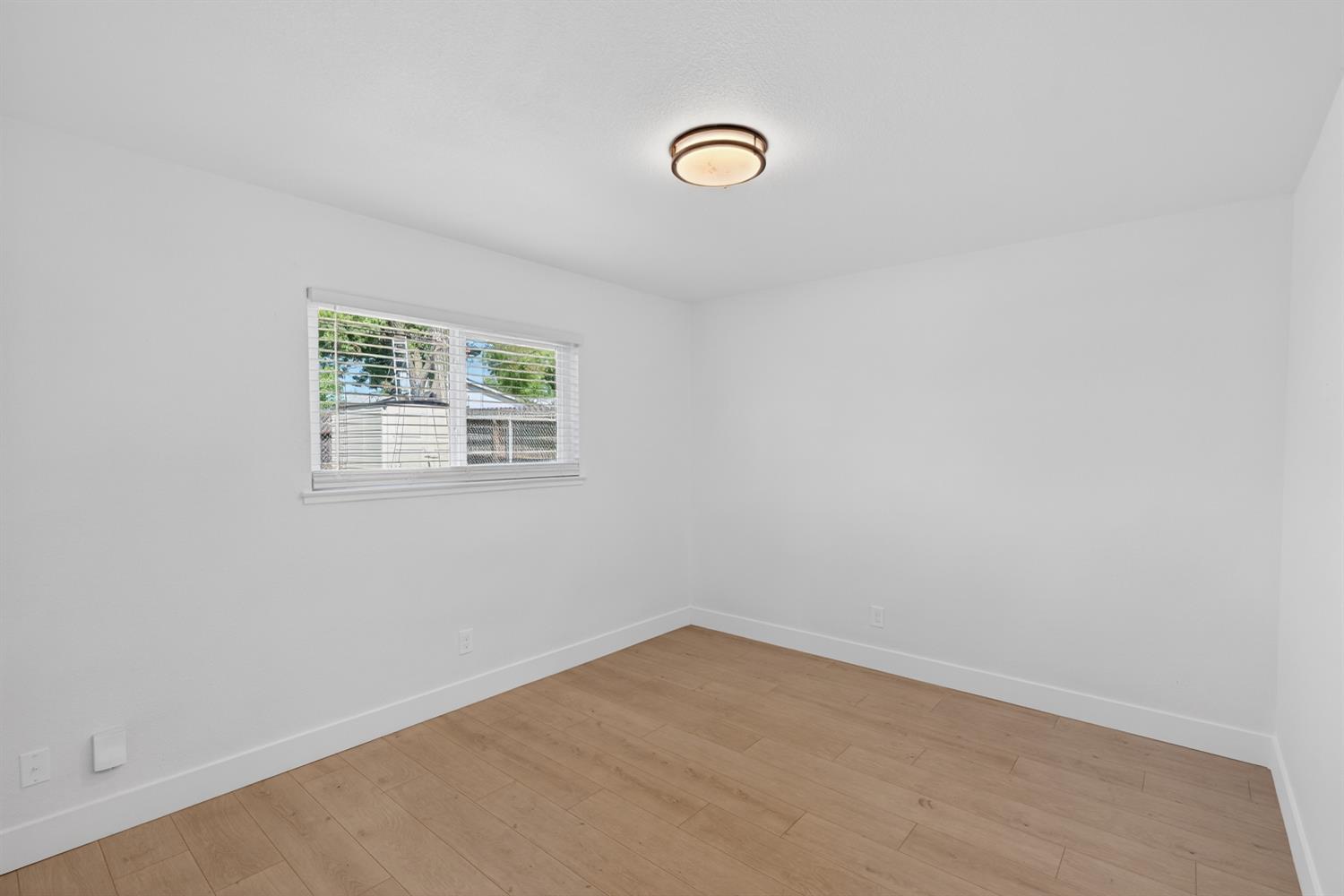 10457 Rockingham Drive Rancho Cordova, CA 95670 - Photo 22 of 49 an empty room with windows