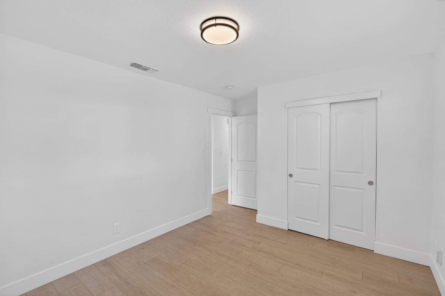 10457 Rockingham Drive Rancho Cordova, CA 95670 - Photo 23 of 49 a view of room with wooden floor