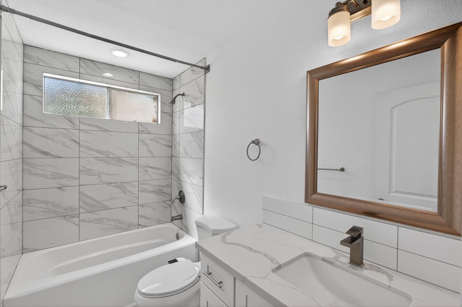 10457 Rockingham Drive Rancho Cordova, CA 95670 - Photo 31 of 49 a bathroom with a bathtub shower sink and toilet