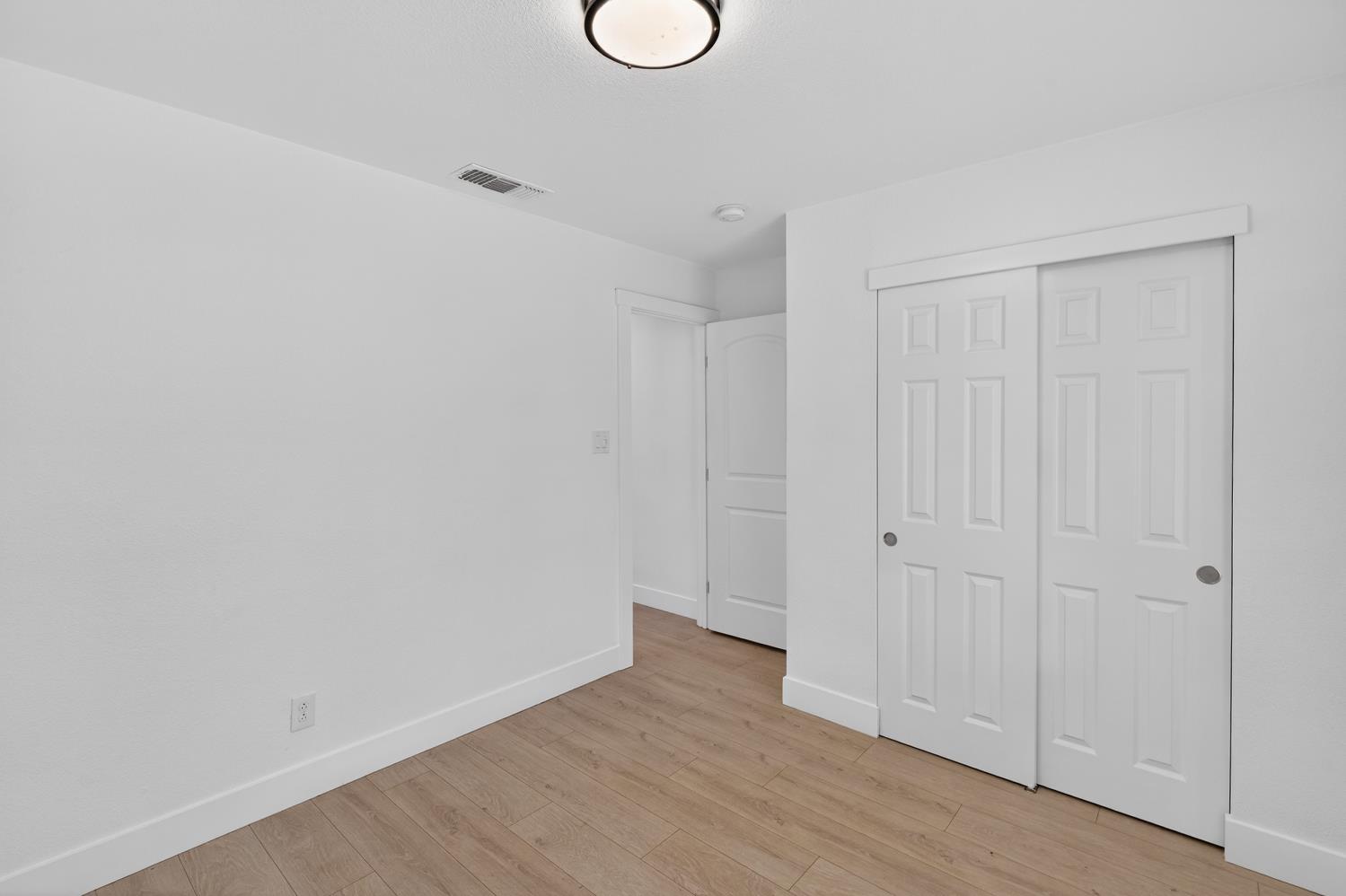 10457 Rockingham Drive Rancho Cordova, CA 95670 - Photo 34 of 49 a view of a room with wooden floor