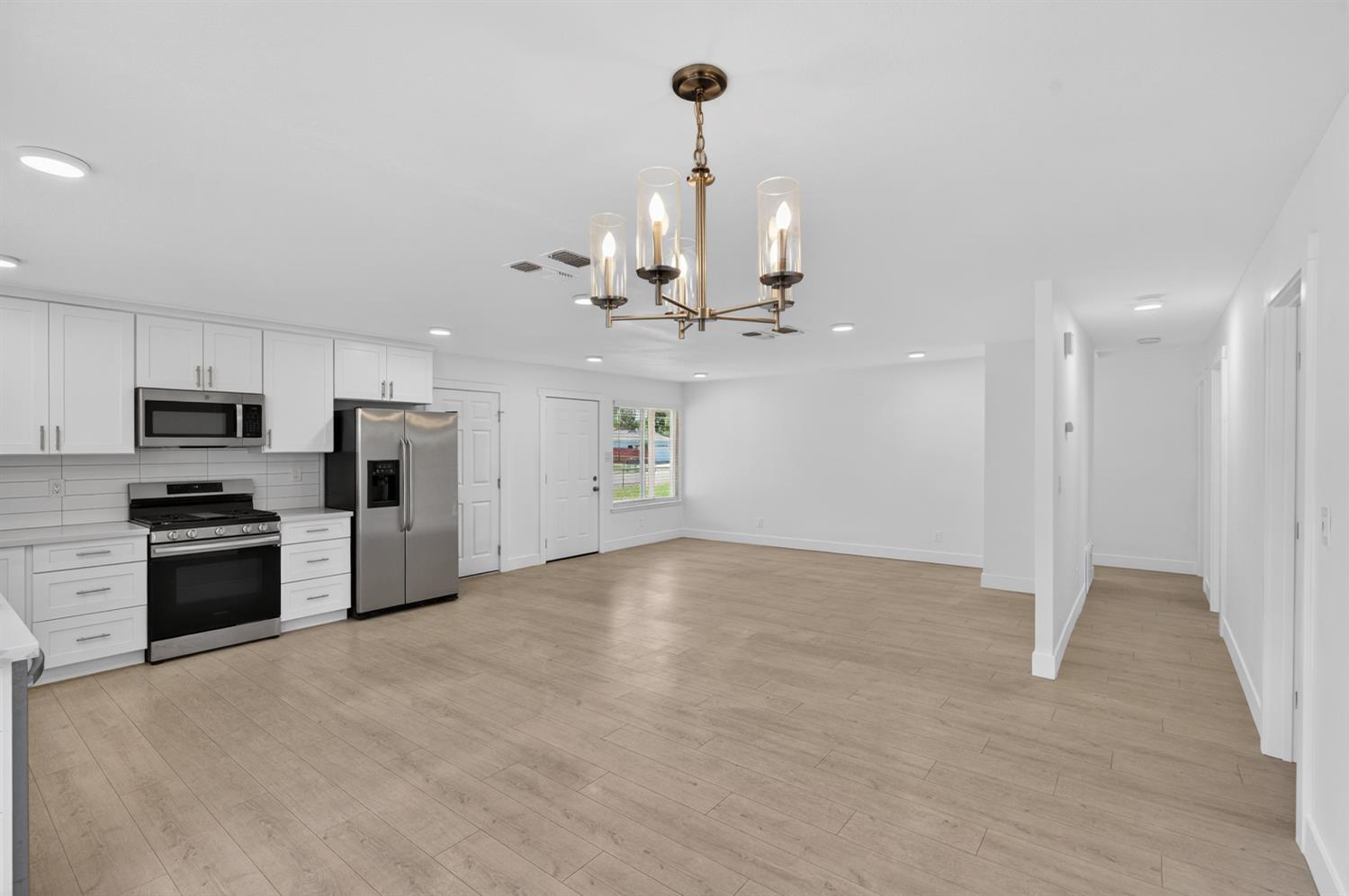 10457 Rockingham Drive Rancho Cordova, CA 95670 - Photo 4 of 49 a view of a kitchen with a sink and stainless steel appliances
