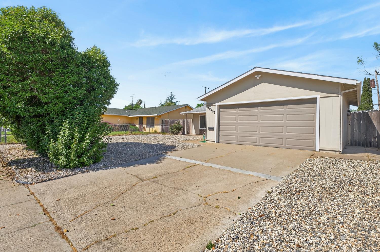 10457 Rockingham Drive Rancho Cordova, CA 95670 - Photo 8 of 49 a front view of a house with a yard and garage
