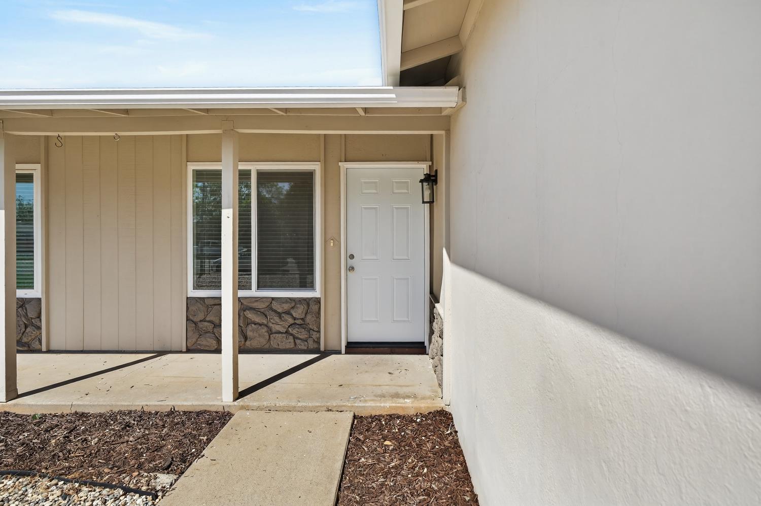 10457 Rockingham Drive Rancho Cordova, CA 95670 - Photo 10 of 49 a entryway view with a wooden door