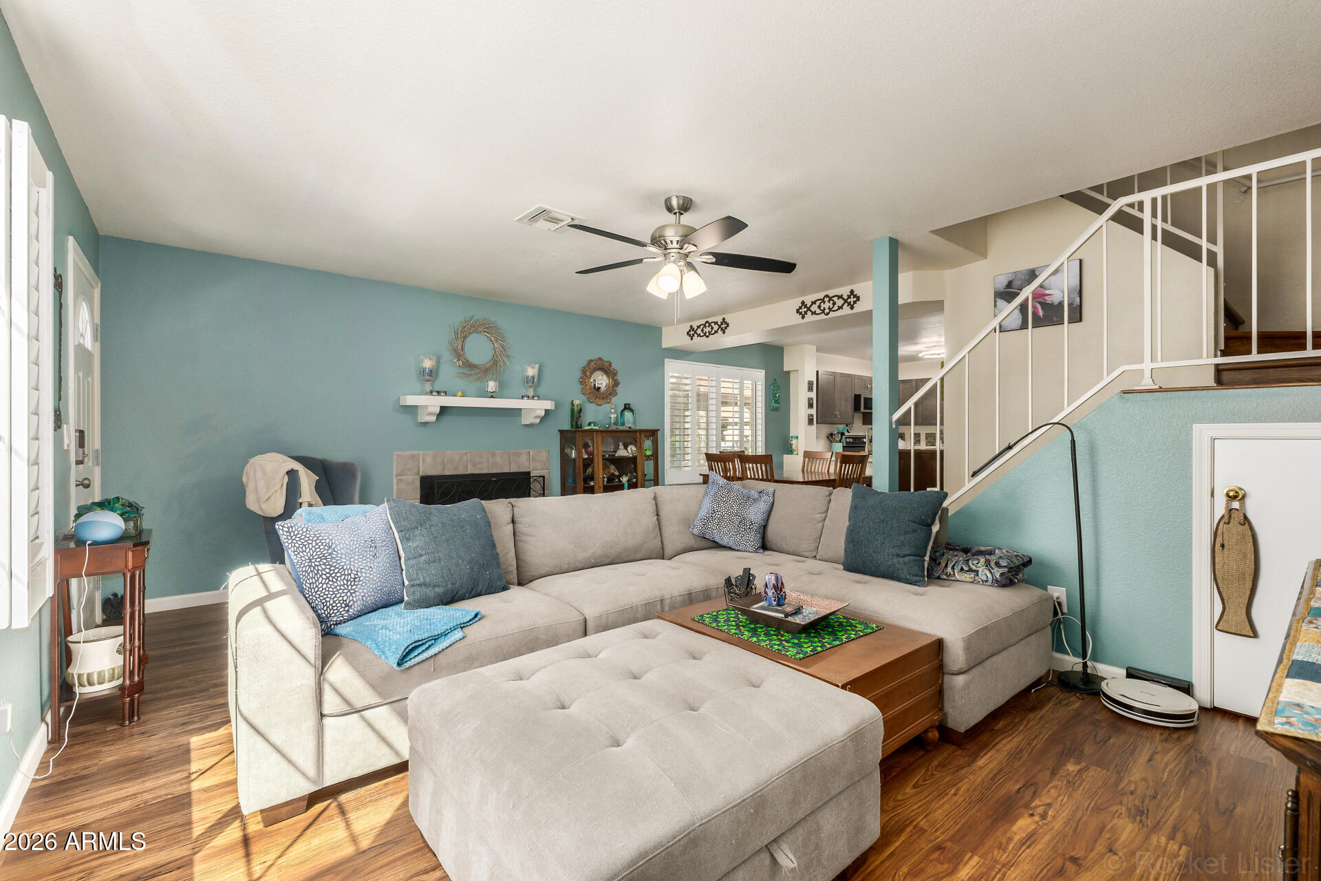 a living room with furniture and a fireplace