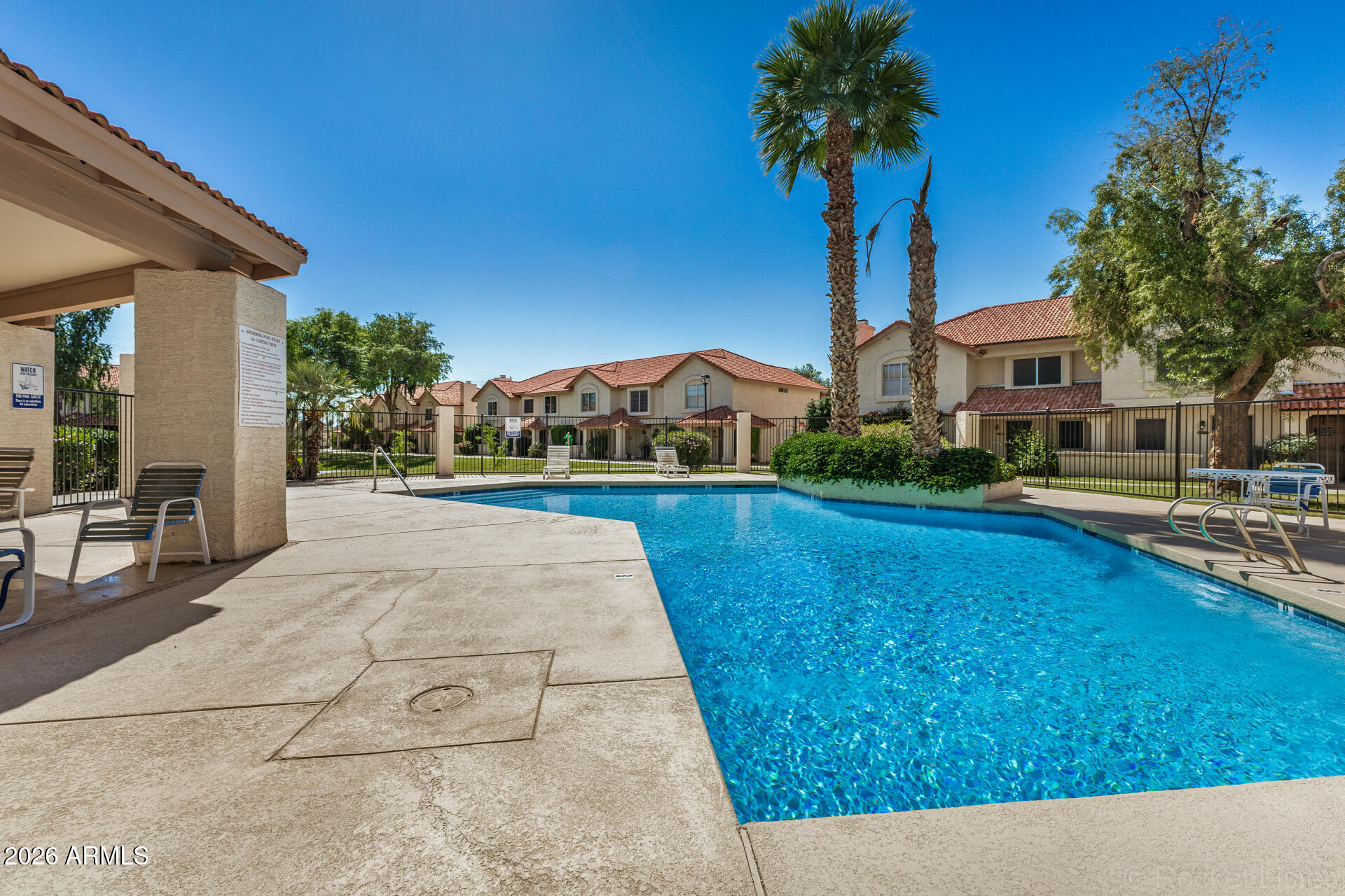 5808 East Brown Road, Unit 143 Mesa, AZ 85205 - Photo 20 of 22 a house view with garden space and trees