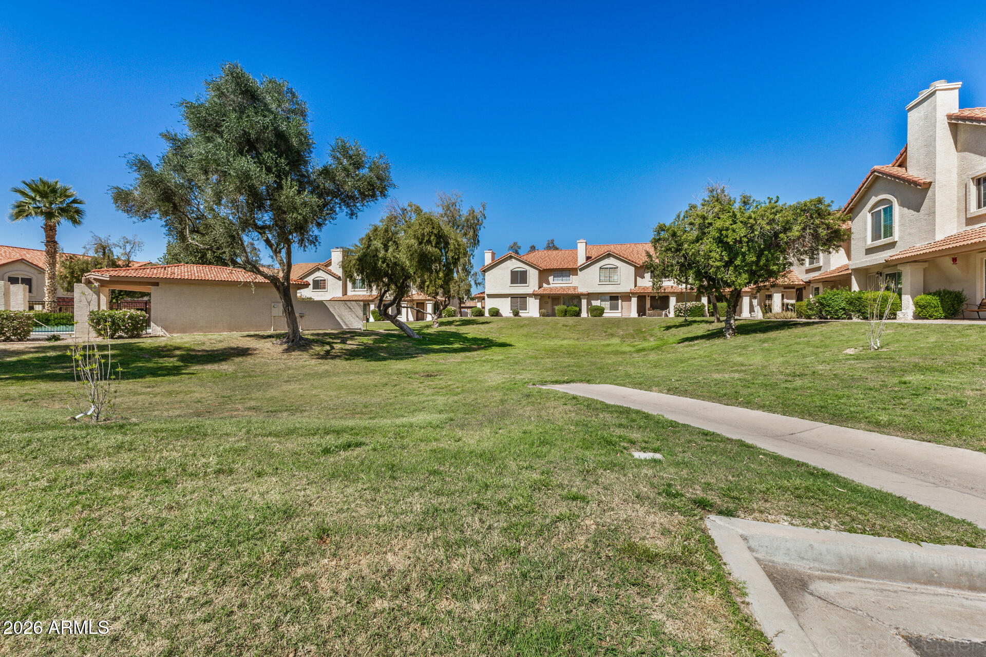 5808 East Brown Road, Unit 143 Mesa, AZ 85205 - Photo 21 of 22 a view of a house with a yard