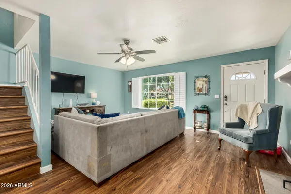 a living room with furniture and a flat screen tv