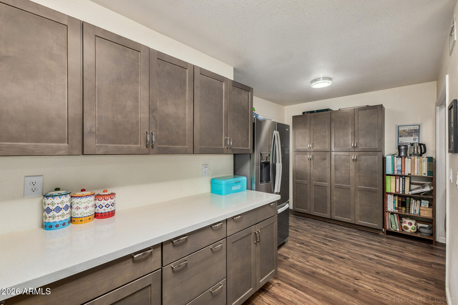 5808 East Brown Road, Unit 143 Mesa, AZ 85205 - Photo 6 of 22 a kitchen with stainless steel appliances a refrigerator and a sink