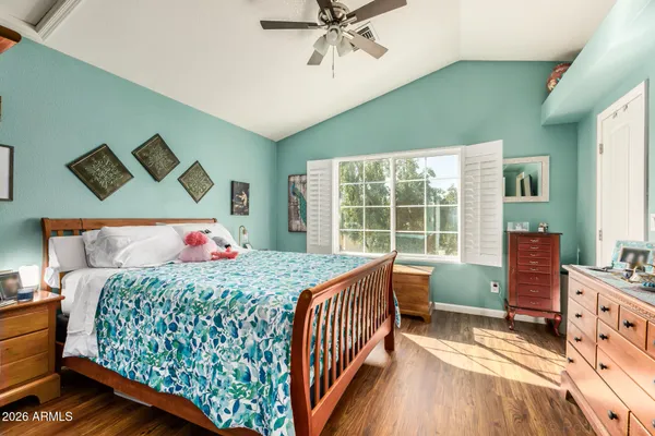 a bedroom with a bed and a window
