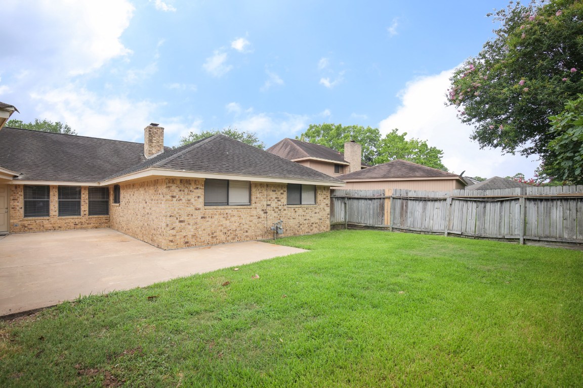 3003 Planters Street Sugar Land, TX 77479 - Photo 15 of 40 a front view of a house with a yard